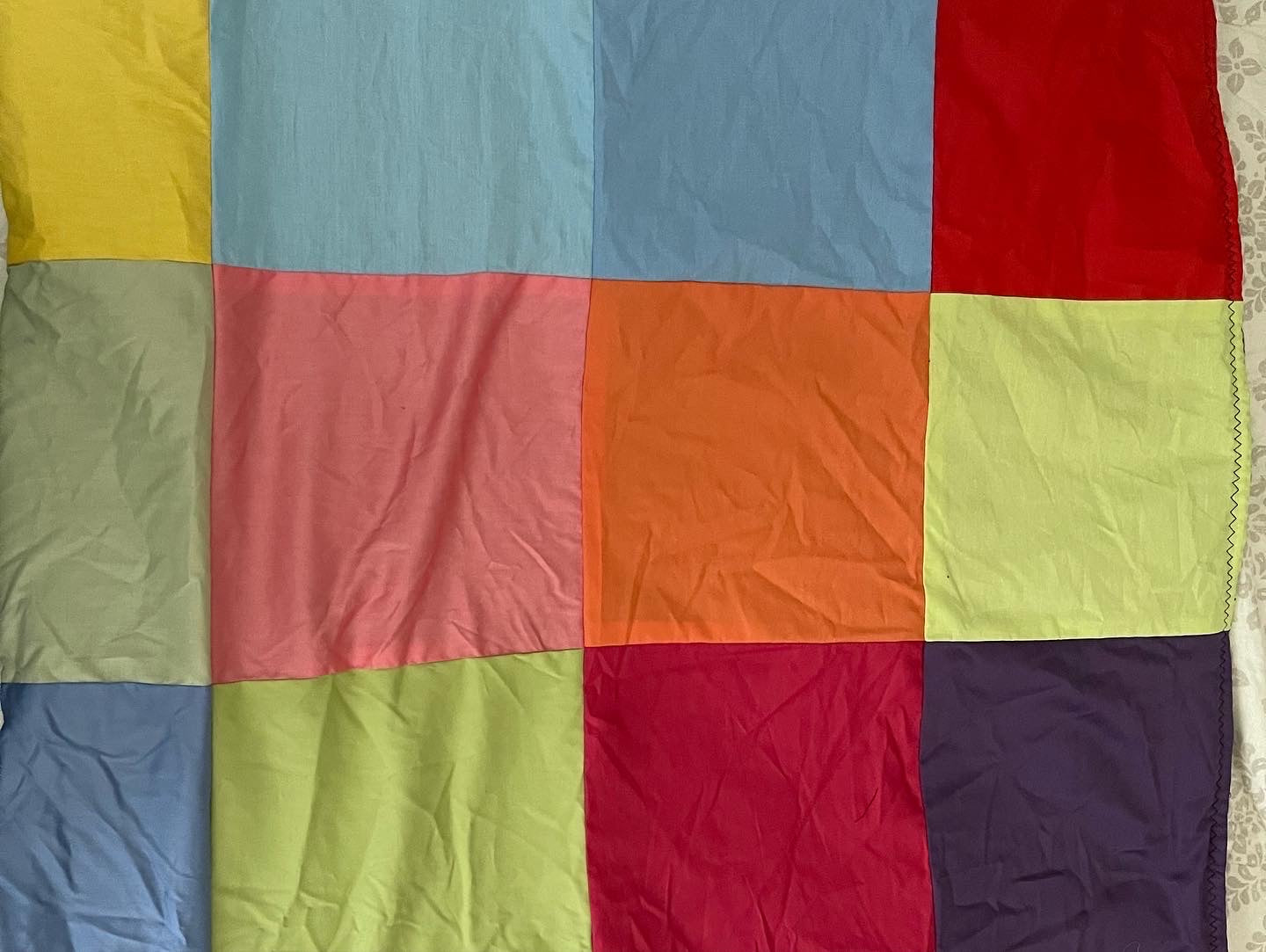 THE QUILT OF MANY COLORS
