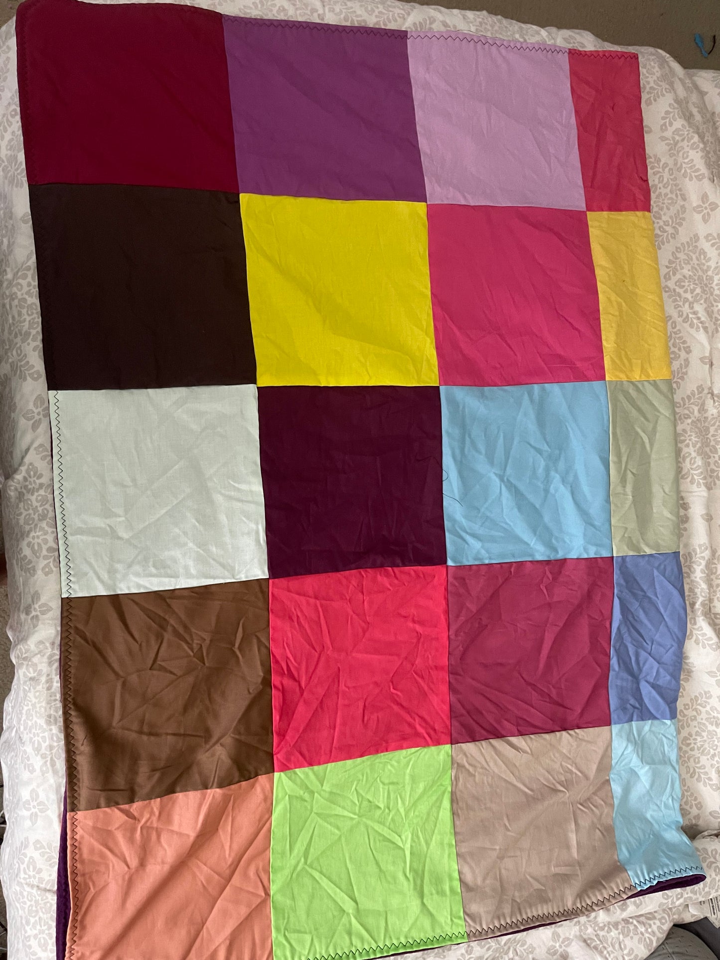 THE QUILT OF MANY COLORS