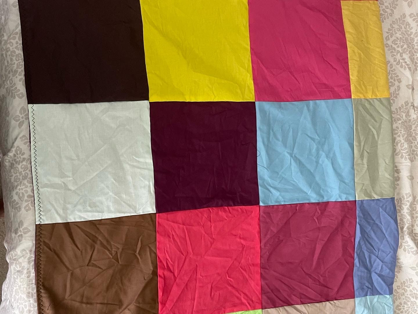 THE QUILT OF MANY COLORS